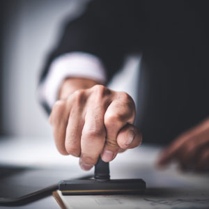 Legal professional validating paperwork for California work permit while awaiting green card.
